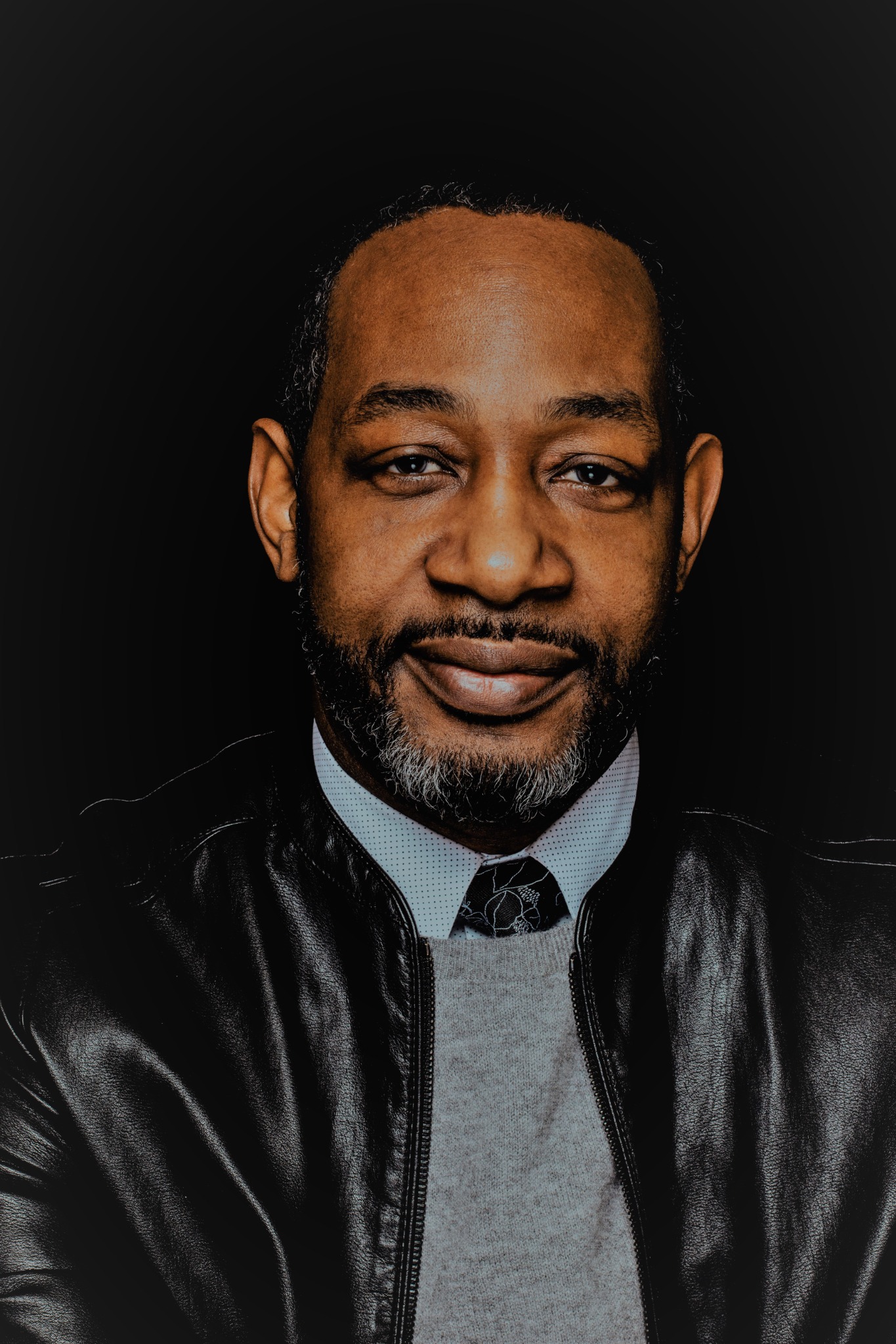 Close portrait of Dr. Lael A. Alexander on black background